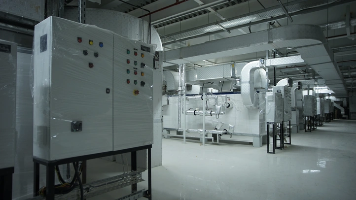 Commissioning and qualification engineers verifying pharmaceutical systems before handover